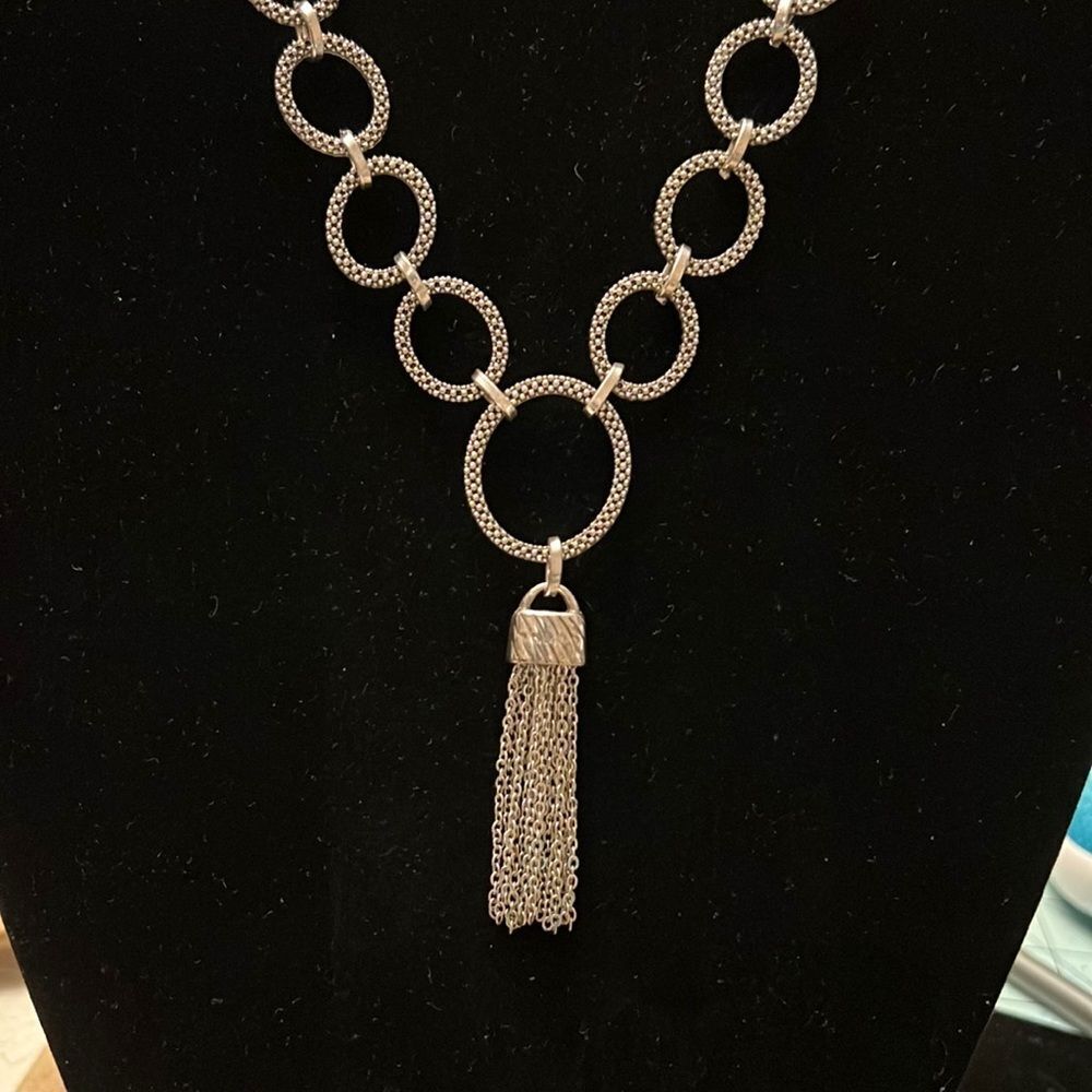 Upcycled jewelry. Beautiful silver tone piece with tassel.